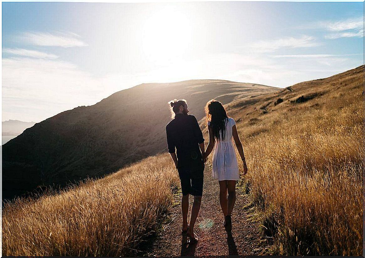 Couple walking holding hands