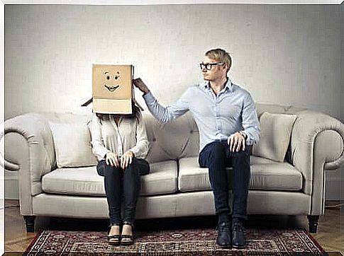 Woman with head in a box and man