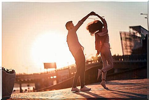 Couple dancing on the street distinguish love