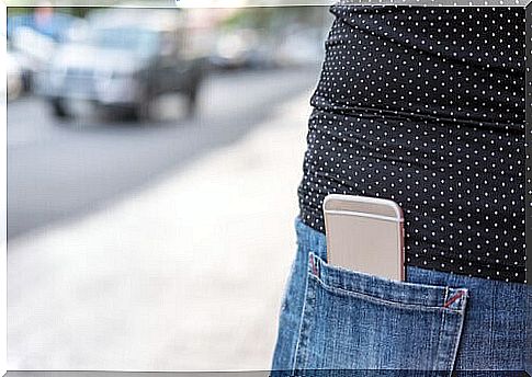 Girl with cellphone in pocket