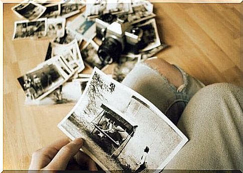 Girl looking at old photographs