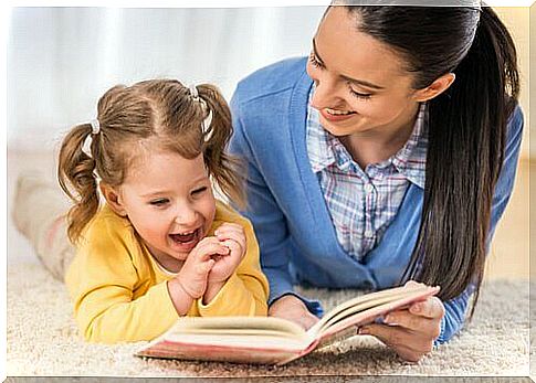 Mom and little girl reading together