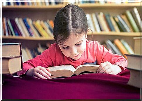 Little girl learning to read