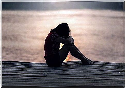 Lonely girl on the pier