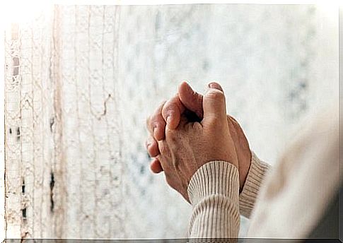 Hands of a person praying