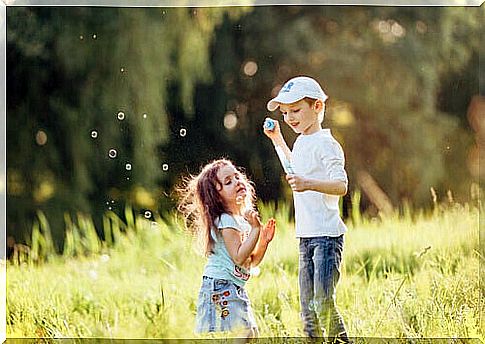 Children making soap bubbles