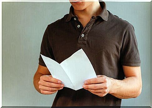 Boy reading an information flyer