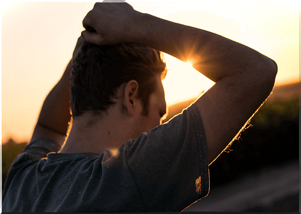 Man with hands on his head