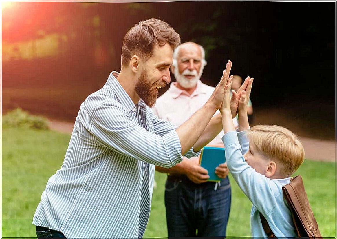 Father and grandfather playing with the child.