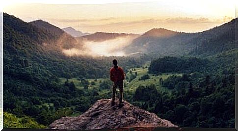 Man on top of a mountain.