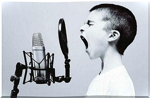 Child singing in front of microphone